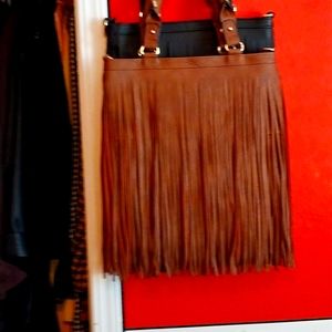Beautiful soho retro leather fringe purses. Fringed all around, like brand new.